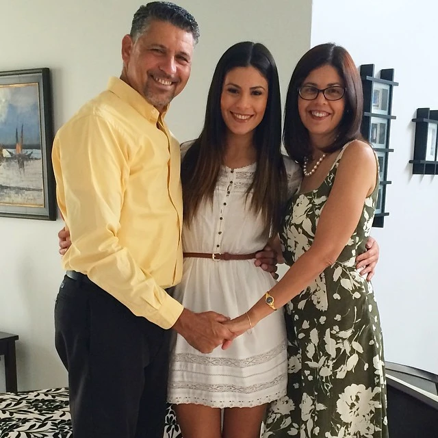 Brhitney Harbaugh with father Alexis Decamps and mother Glenda Decamps